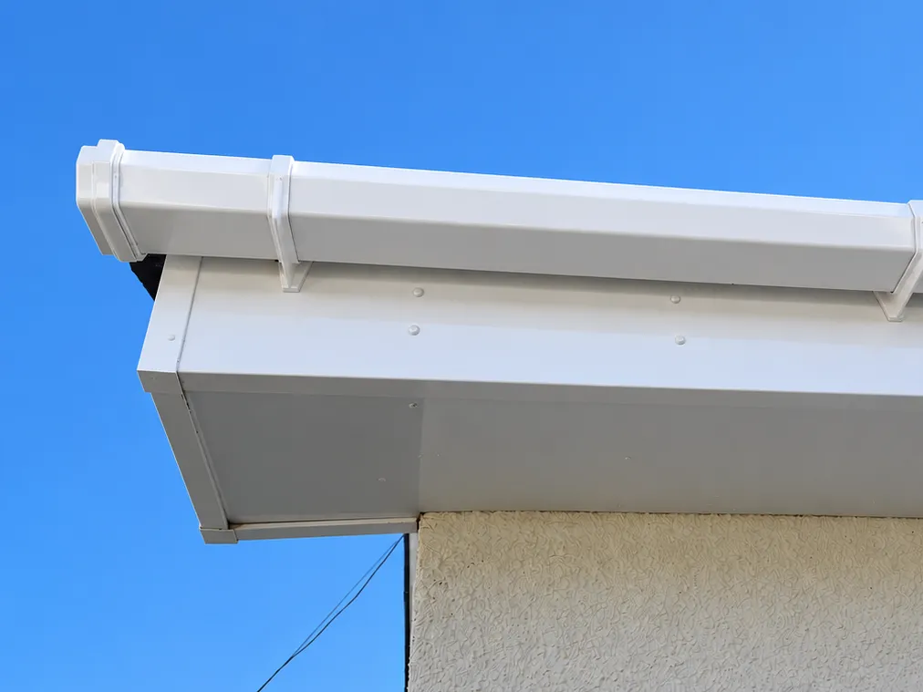 The same gutter, fascia and soffit after cleaning, bright white